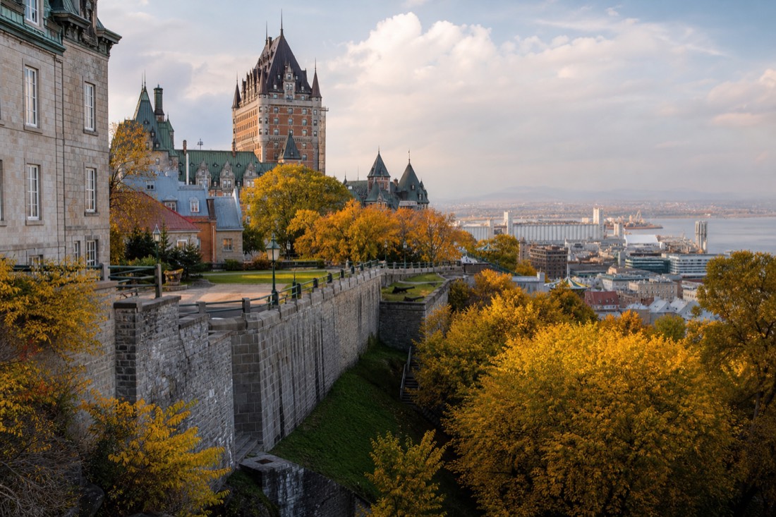 Comparison view of Quebec City in autumn with golden trees along the fortification walls and open sidewalks