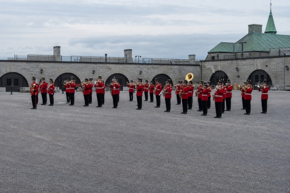 Royal 22e Regiment band in red dress uniform performing on the parade square at the Citadelle of Quebec