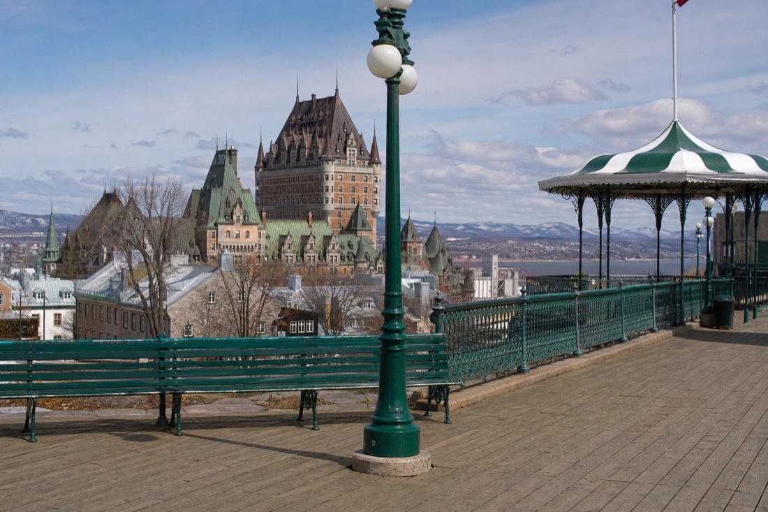 Street performers and summer visitors on the Dufferin Terrace boardwalk in Quebec City