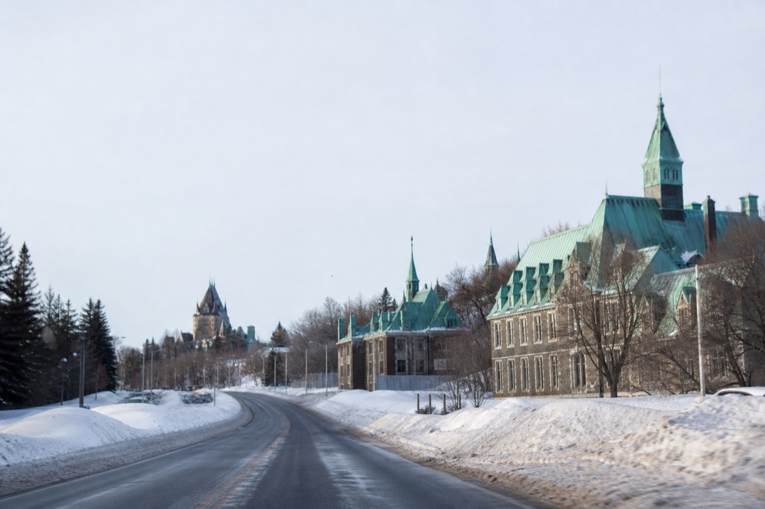 Winter road heading north from Quebec City toward Valcartier with snowbanks along both sides