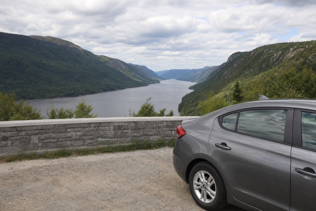Rental car parked at a viewpoint above the Jacques-Cartier River valley on a day trip from Quebec City