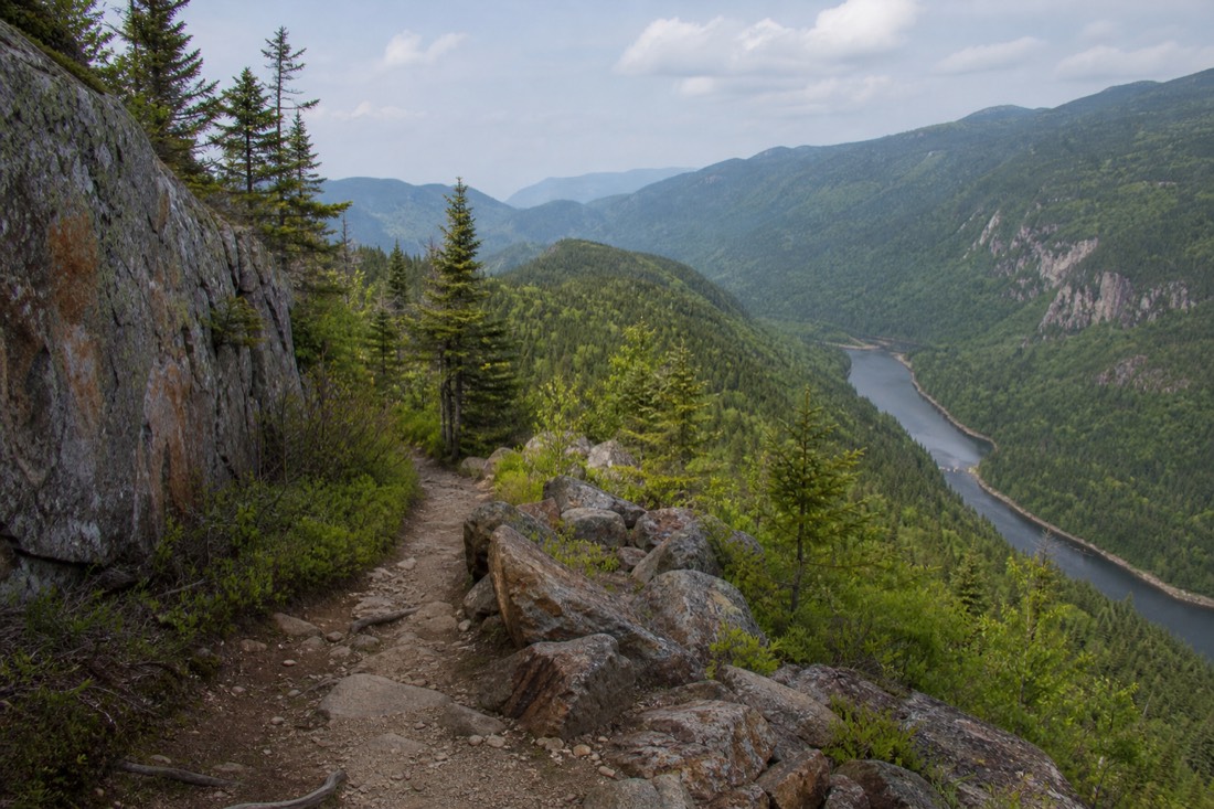 Hikers on a marked trail above the Jacques-Cartier River valley in summer