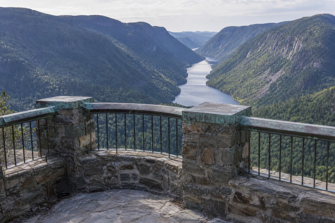 Lookout view down the length of the Jacques-Cartier River valley with steep forested walls