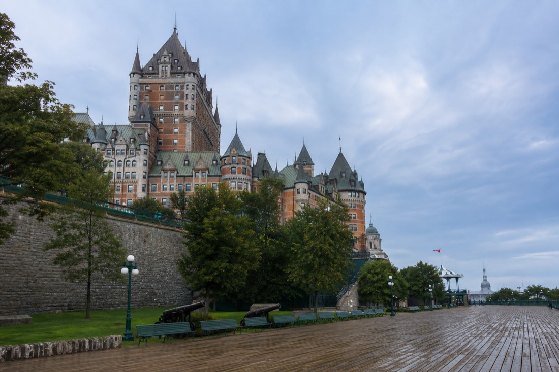 Day trippers walking below the Chateau Frontenac on Dufferin Terrace in summer