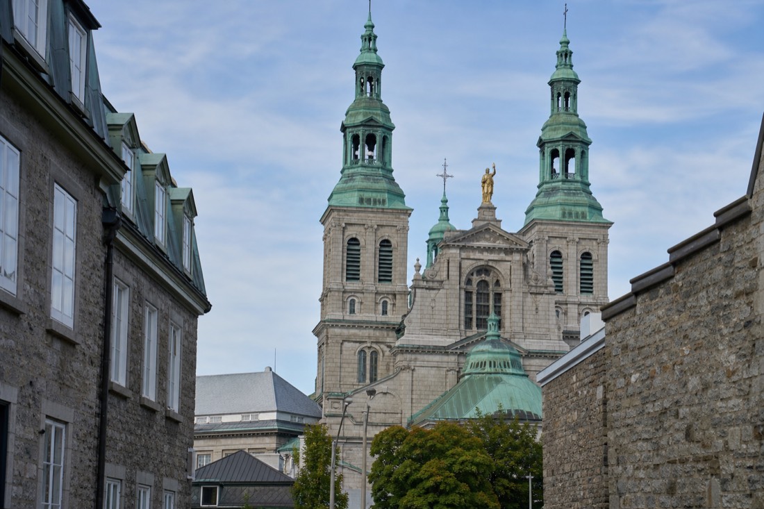 Exterior of the Notre-Dame de Québec Basilica-Cathedral with its stone towers seen from rue De Buade in Old Quebec