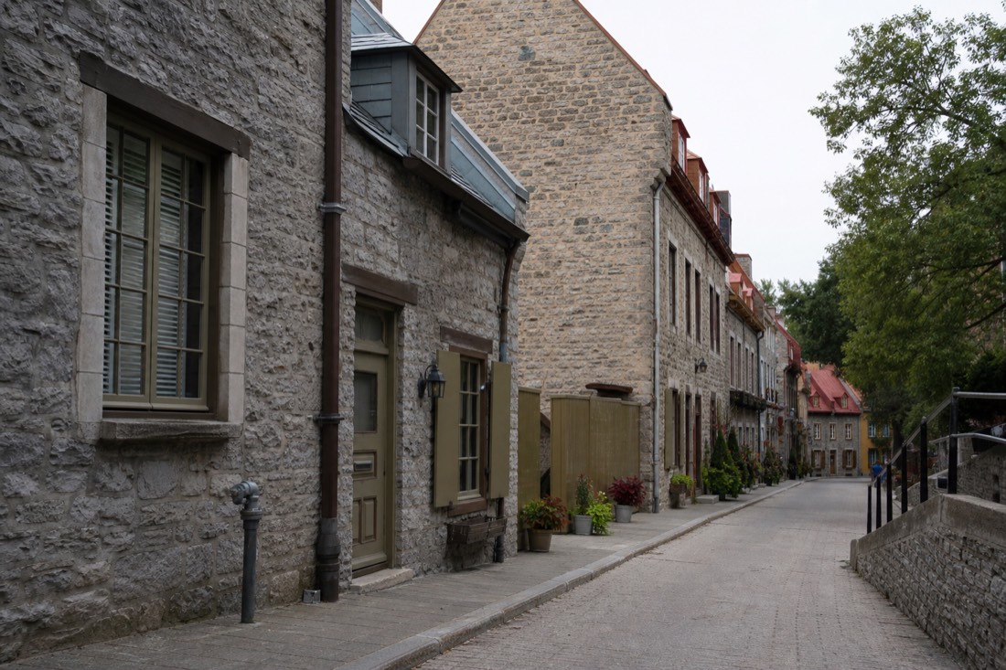 Old stone merchant buildings along Petit Champlain in Lower Town Quebec City, one of the oldest commercial streets in North America