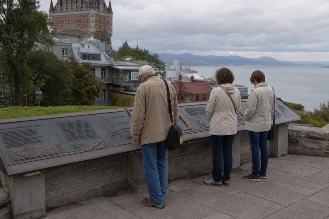 Visitors reading interpretation panels about the 1759 battle at the Plains of Abraham Museum in Quebec City