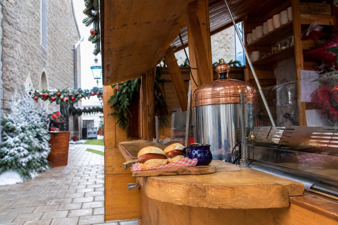 Bratwurst and mulled wine served at a wooden kiosk at the German Christmas Market in Quebec City