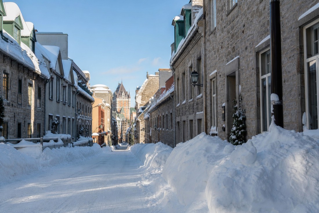 Deep snowbanks lining rue Saint-Louis in Old Quebec on a bright January morning