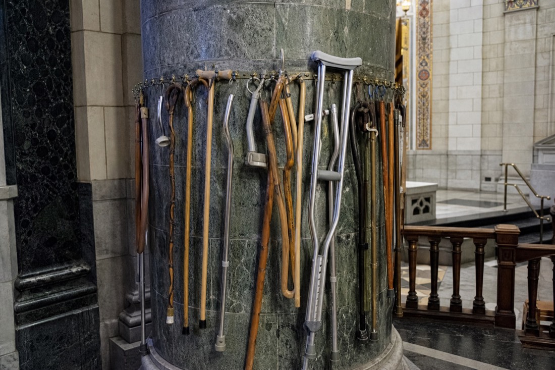 Pillar inside Sainte-Anne-de-Beaupre hung with crutches and canes left by pilgrims